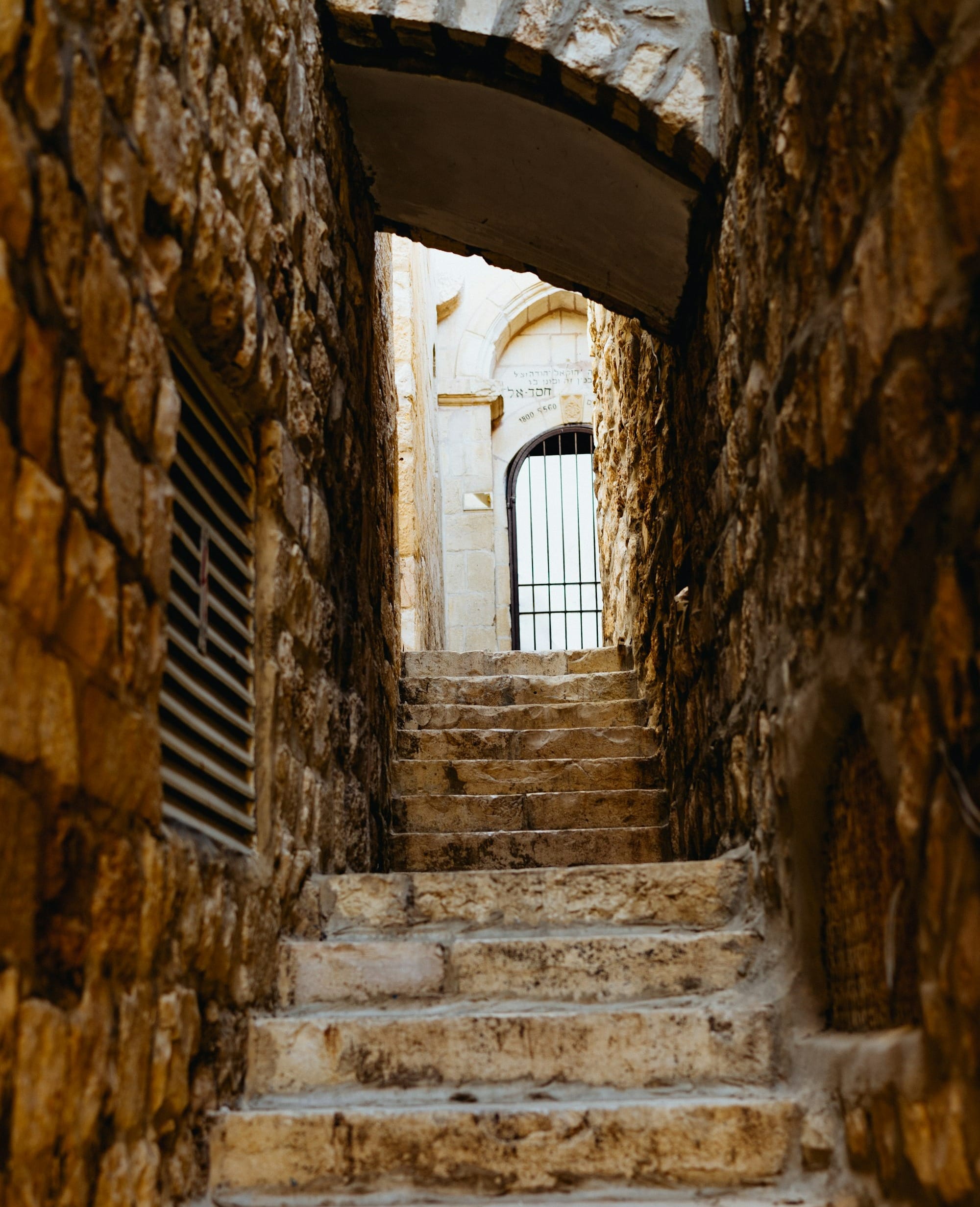 concrete stairs in between walls